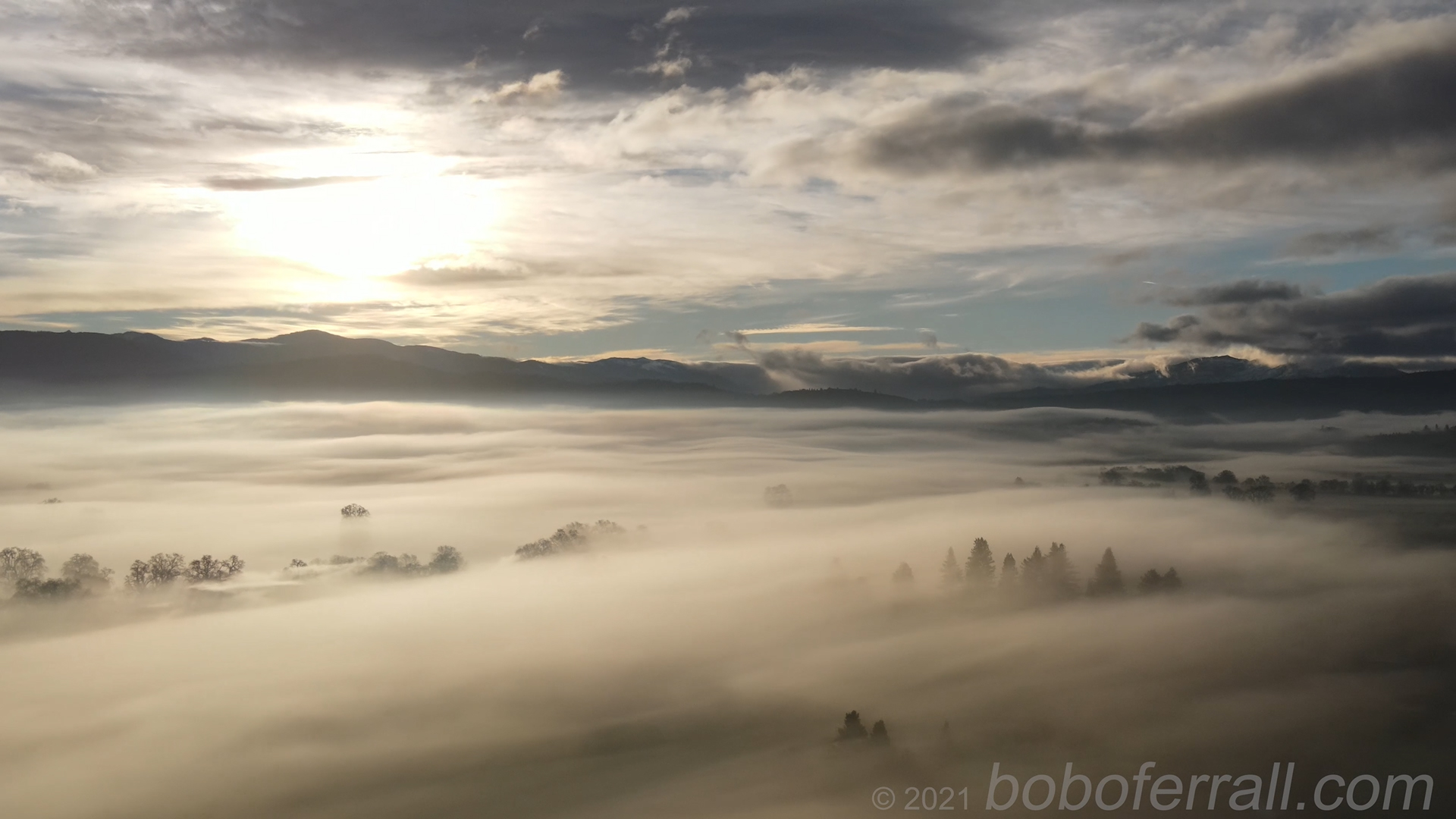 Round Valley Sunrise and Mountain Views over fog over Covelo, California December 20, 2021 at Covelo, CA-USA By Robert OFerrall